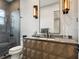 This bathroom features a unique vanity with a geometric pattern, modern lighting and a glass enclosed shower at 4907 Topsail Dr, Nokomis, FL 34275