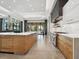 Open kitchen with a large island, modern appliances, and a view to the outdoors at 4907 Topsail Dr, Nokomis, FL 34275