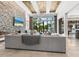 Bright living room showcasing water views, a modern fireplace, and designer lighting at 4907 Topsail Dr, Nokomis, FL 34275