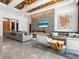 Comfortable living room boasting a linear fireplace, TV, and unique natural wood accents at 4907 Topsail Dr, Nokomis, FL 34275