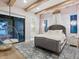 A stylish main bedroom featuring a hanging bubble chair, a plush rug, and elegant finishes at 4907 Topsail Dr, Nokomis, FL 34275