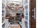 Organized pantry with custom shelving, wooden countertops, and ample storage at 4907 Topsail Dr, Nokomis, FL 34275