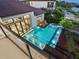 Aerial view of a modern pool with stepping stones and a lounge area at 4907 Topsail Dr, Nokomis, FL 34275