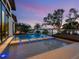 Modern pool with stepping stones and a lounge area with an ocean view at 4907 Topsail Dr, Nokomis, FL 34275
