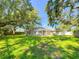 Enjoy this private backyard surrounded by mature trees and lawn at 4913 32Nd E St, Bradenton, FL 34203