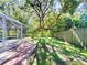 Enjoy this spacious backyard surrounded by mature trees and new fence for privacy at 4913 32Nd E St, Bradenton, FL 34203