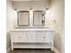 Bathroom featuring a double sink vanity with granite countertop and modern fixtures at 4913 32Nd E St, Bradenton, FL 34203