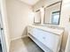 Bathroom with double sink vanity, granite countertops and modern fixtures at 4913 32Nd E St, Bradenton, FL 34203