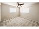 Bedroom featuring carpet flooring, two windows, and neutral paint at 4913 32Nd E St, Bradenton, FL 34203