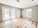Bright bedroom with wood-look floors and access to the backyard at 4913 32Nd E St, Bradenton, FL 34203