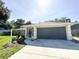Well-maintained single-story home with a two-car garage and manicured landscaping at 4913 32Nd E St, Bradenton, FL 34203