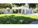 Well-maintained front yard and home exterior showcasing beautiful landscaping and attached garage at 4913 32Nd E St, Bradenton, FL 34203
