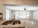 Granite countertops and stainless sink overlooking the bright living room at 4913 32Nd E St, Bradenton, FL 34203