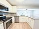 Updated kitchen features stainless steel appliances, granite countertops, and ample cabinet space at 4913 32Nd E St, Bradenton, FL 34203