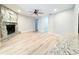 Spacious living room featuring hardwood floors, stone fireplace, and granite countertops at 4913 32Nd E St, Bradenton, FL 34203