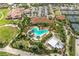 Stunning aerial view of the community pool, clubhouse, and lush landscaping at 5234 Napoli Run, Bradenton, FL 34211