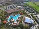 Beautiful aerial view of resort-style pool, clubhouse, and tennis courts at 5234 Napoli Run, Bradenton, FL 34211