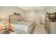 Bright and airy bedroom offering a calm atmosphere and neutral color scheme throughout at 5234 Napoli Run, Bradenton, FL 34211