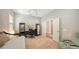 Spacious bedroom with a daybed, mirrored cabinets, and a desk area, offering ample storage and a comfortable layout at 5234 Napoli Run, Bradenton, FL 34211