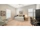 Bright bedroom with shuttered windows, a daybed adorned with decorative pillows, and a desk, creating a versatile space at 5234 Napoli Run, Bradenton, FL 34211