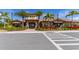 The Community Clubhouse features lush landscaping, stone accents, and covered entryways, inviting residents and guests alike at 5234 Napoli Run, Bradenton, FL 34211