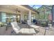 Spacious covered lanai with outdoor lounge chairs and hot tub offers a serene retreat, blending indoor and outdoor living at 5234 Napoli Run, Bradenton, FL 34211