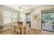 Bright dining area with ample natural light and seamless access to the outdoors at 5234 Napoli Run, Bradenton, FL 34211