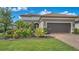 Beautiful single-Gathering home with a two-car garage and lush landscaping at 5234 Napoli Run, Bradenton, FL 34211