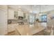 Well-lit kitchen with an island, pendant lighting and seamless access to the dining area at 5234 Napoli Run, Bradenton, FL 34211