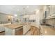 Open-concept kitchen featuring a large island, stainless appliances, and ample cabinetry at 5234 Napoli Run, Bradenton, FL 34211