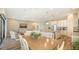 Open-concept living area showcasing an island, stainless appliances, tile backsplash, and breakfast bar at 5234 Napoli Run, Bradenton, FL 34211