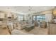 Bright, open-concept living room seamlessly connected to the kitchen and dining area at 5234 Napoli Run, Bradenton, FL 34211