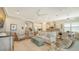 Relaxing living room and kitchen boasting an open floor plan with contemporary features at 5234 Napoli Run, Bradenton, FL 34211