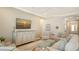 Comfortable living room area featuring a large television and an inviting atmosphere at 5234 Napoli Run, Bradenton, FL 34211