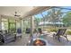 Outdoor patio featuring a fire pit, comfortable seating, and a grill area, perfect for entertaining and enjoying outdoor living at 5234 Napoli Run, Bradenton, FL 34211