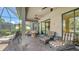 An expansive covered patio includes a stone fire pit, comfortable seating and is ideal for entertaining or relaxing outdoors at 5234 Napoli Run, Bradenton, FL 34211