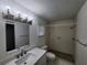 Bright bathroom featuring shower stall, toilet, and white vanity with updated fixtures at 5629 Boulder Blvd, Sarasota, FL 34233