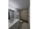 Bathroom featuring a shower, vanity, modern lighting, and tiled floor at 5629 Boulder Blvd, Sarasota, FL 34233