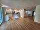 Spacious kitchen with modern appliances, white cabinets, and wood-look flooring at 5629 Boulder Blvd, Sarasota, FL 34233