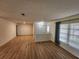 Open-concept living area featuring stylish wood flooring and a view of the home's entryway at 5629 Boulder Blvd, Sarasota, FL 34233