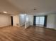Bright living room with wood-look flooring, neutral walls, and natural light at 5629 Boulder Blvd, Sarasota, FL 34233