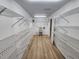 Large walk-in pantry with lots of storage, shelving, and laminate flooring at 5629 Boulder Blvd, Sarasota, FL 34233