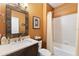 Bathroom with single sink vanity, tub and shower at 6155 Aviary Ct, Bradenton, FL 34203
