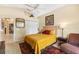 Vaulted-ceiling bedroom featuring neutral carpet, large window, and ceiling fan at 6155 Aviary Ct, Bradenton, FL 34203