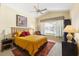 Sunlit bedroom featuring vaulted ceiling, neutral carpet and large sunny window at 6155 Aviary Ct, Bradenton, FL 34203