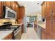 Well-equipped kitchen features granite countertops, stainless steel appliances, and a convenient layout for cooking and entertaining at 6155 Aviary Ct, Bradenton, FL 34203