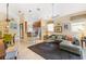 Open-concept living room with seamless flow to the kitchen and dining area, perfect for entertaining guests at 6155 Aviary Ct, Bradenton, FL 34203