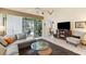Inviting living room with tile flooring, plush seating, and a seamless transition to the screened-in patio at 6155 Aviary Ct, Bradenton, FL 34203