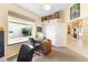 Bright home office space featuring a large window overlooking the courtyard and neutral color scheme at 6155 Aviary Ct, Bradenton, FL 34203