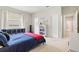 Bright bedroom showcasing a window, a bookshelf and a comfortable bed at 6216 Donnington Ct, Sarasota, FL 34238